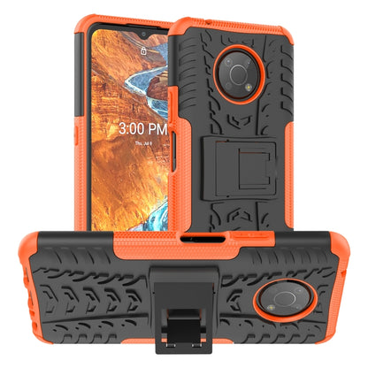 Tire-textured phone case with built-in holder, orange and black
