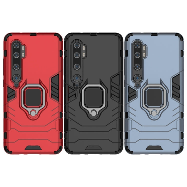 Rugged phone cases with magnetic ring holders: red, black, and navy