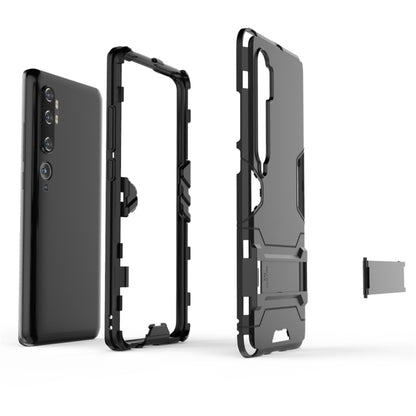 Shockproof dark phone case with visible holder bracket and camera protection