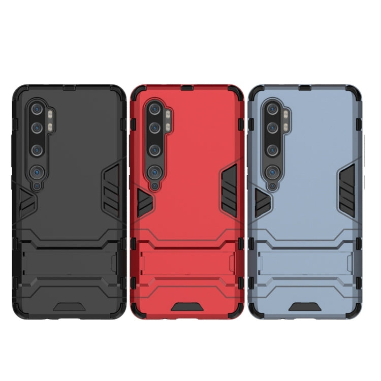 Shockproof phone cases set: black, red, and blue with protective bumper
