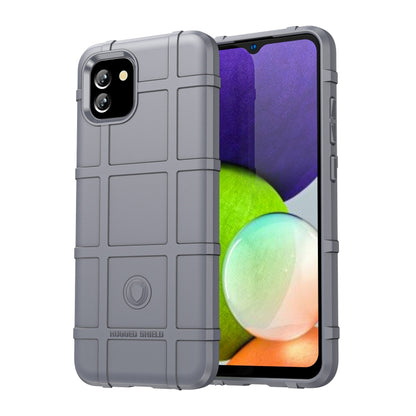 Rugged light gray TPU phone case with shockproof bumpers, textured panels, and camera openings.