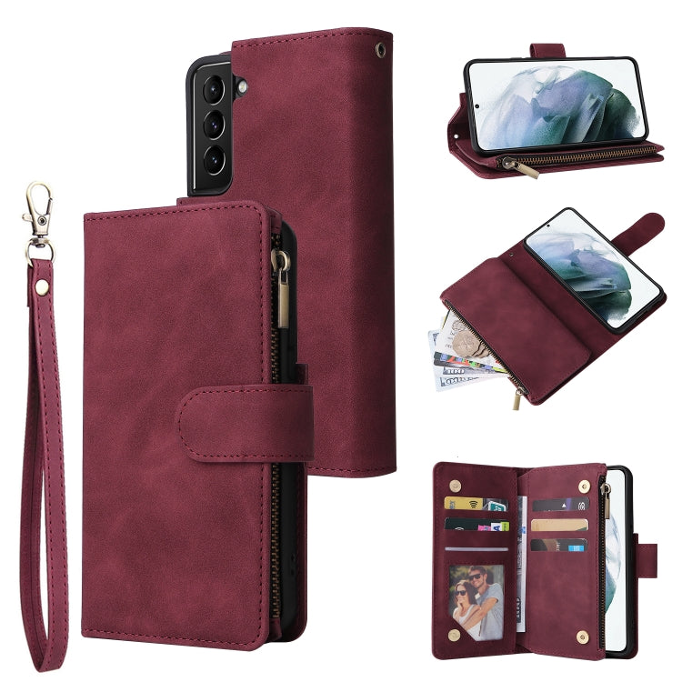 Wine red leather phone wallet case with card holder, zipper closure, and wrist strap