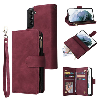 Wine red leather phone wallet case with card holder, zipper closure, and wrist strap