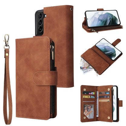 Brown leather phone wallet case with wrist strap, card holder, and zippered pocket