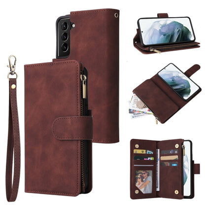 Reddish-brown leather phone wallet case with wrist strap, card holder, and zip pocket