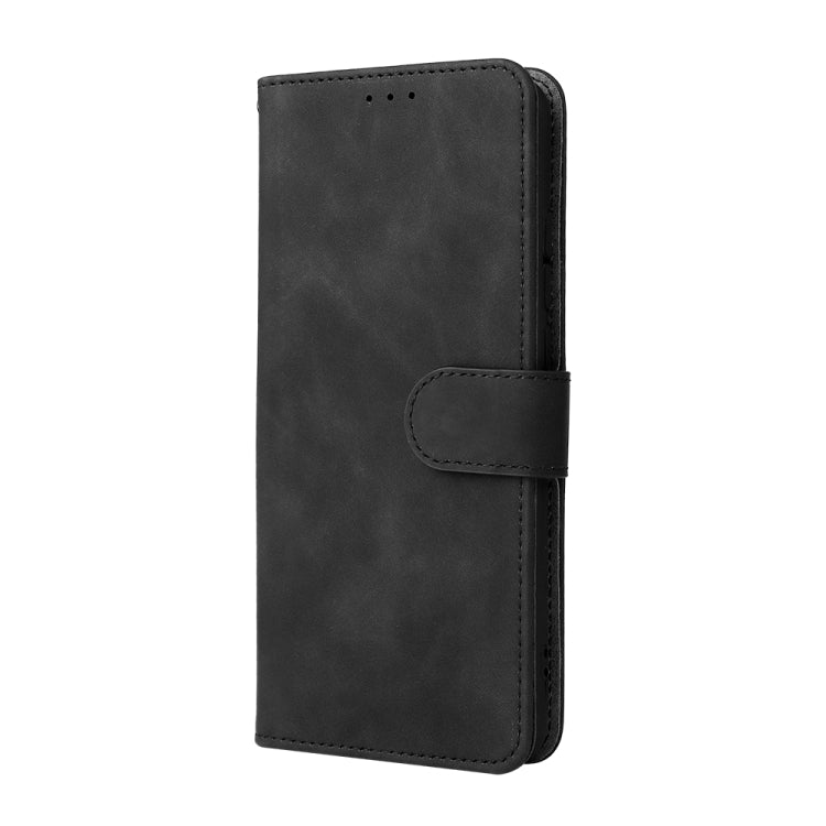 Black vertical flip phone case with magnetic buckle closure and stitched edges.