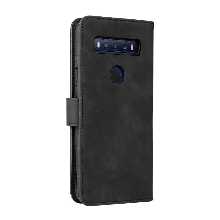 Black leather phone case with camera cutout and magnetic side strap.