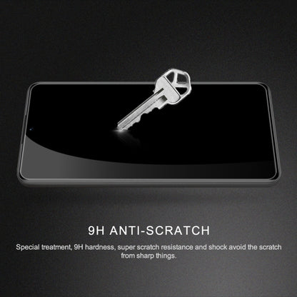 Tempered glass screen protector film on smartphone screen for scratch protection