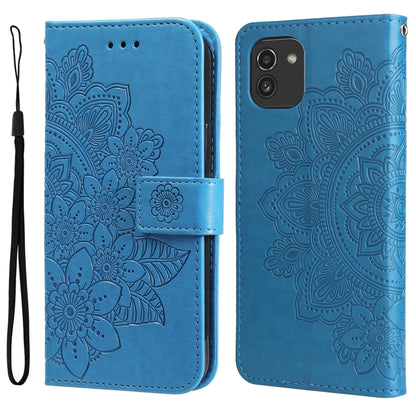 Blue embossed floral flip phone case with wrist strap and camera/front cutouts.
