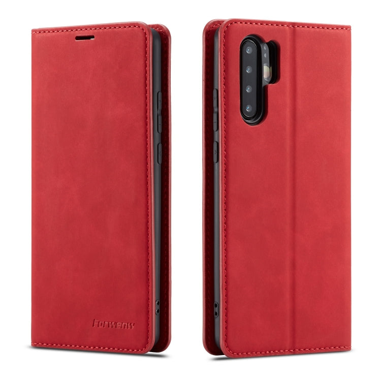 Red leather flip phone case with stitched edges and rear camera and flash cutouts.