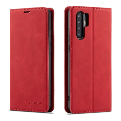 Red leather flip phone case with stitched edges and rear camera and flash cutouts.