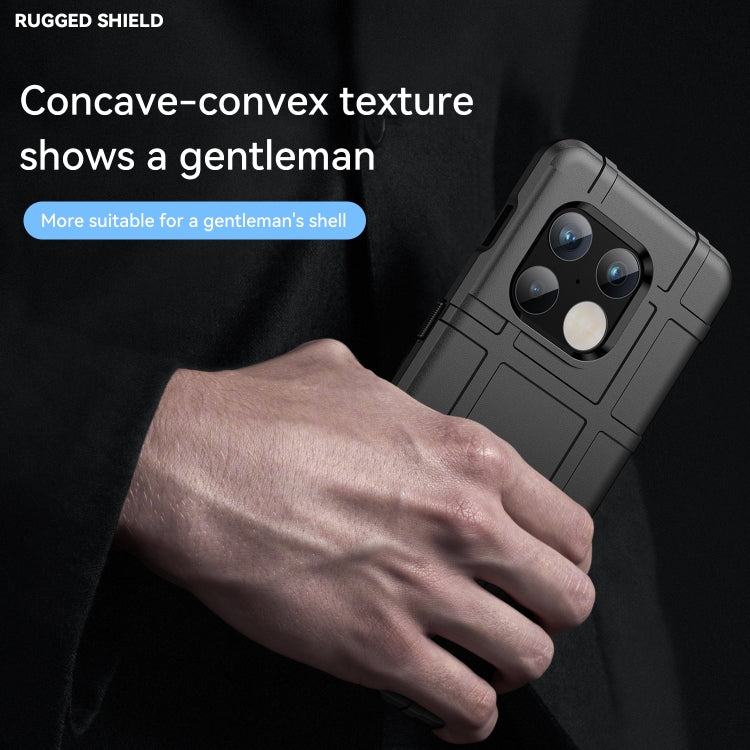 Black rugged TPU phone case with grippy textured back, held by hand