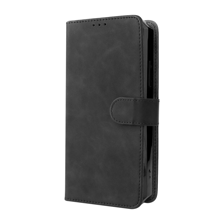 Black leather phone case with flip cover and magnetic closure, side cutout.