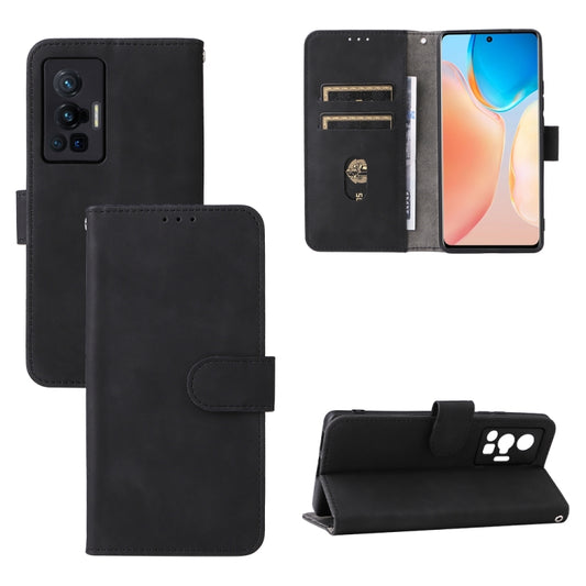 Magnetic leather phone case with front wallet flap and snap tab, black.