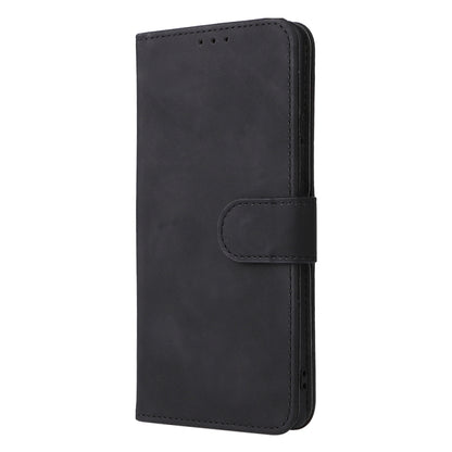 Black leather phone case with side buckle strap and circular snap closure.