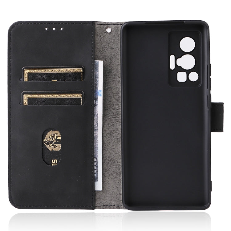Black leather phone case opened view, with card slots and magnetic closure.