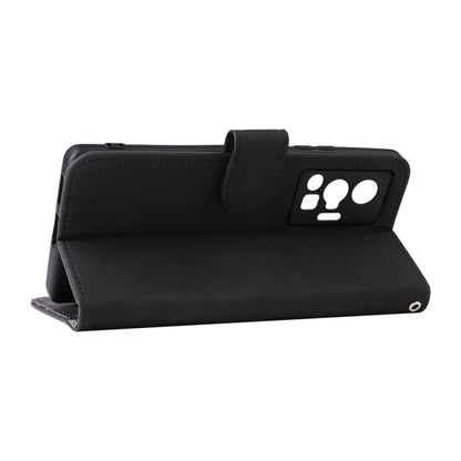 Black leather folio phone case with magnetic flap and paw-print card holder.