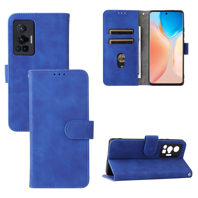 Blue leather magnetic phone case with flip cover, card slots, and stand.