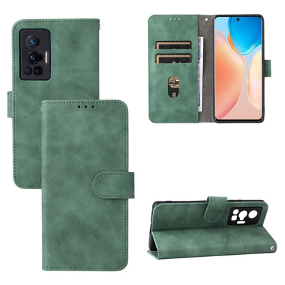 Green leather magnetic phone case with flip cover, card slots, and stand.