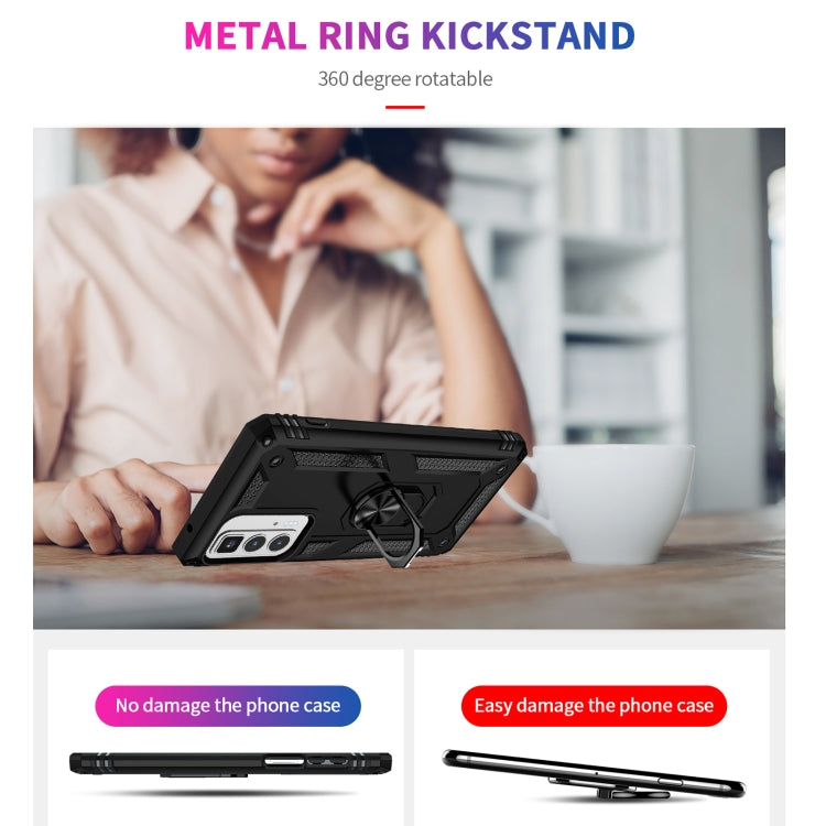 Black phone case with metal ring kickstand, shown on a desk