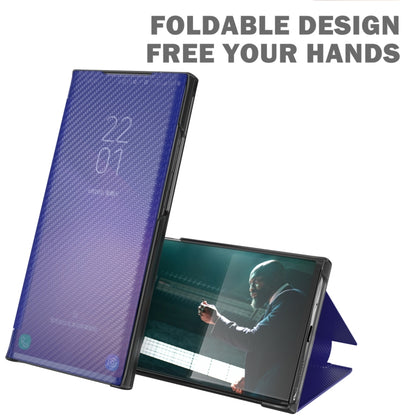 Carbon-fiber textured flip phone case, dark blue/purple, open with kickstand support.