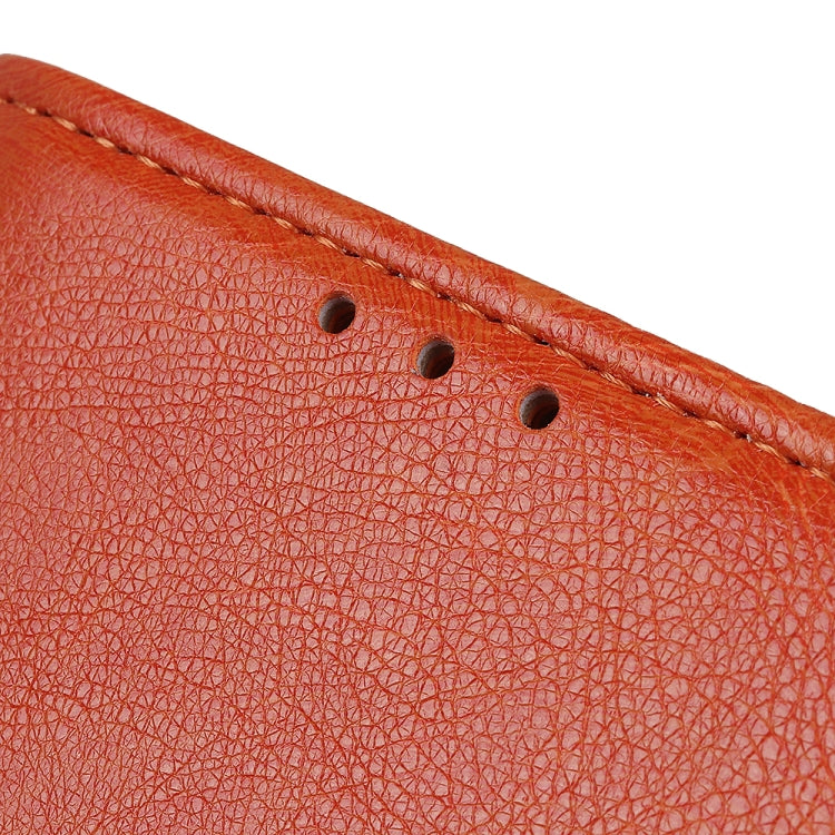 Close-up of orange textured leather flip phone case stitching and perforation