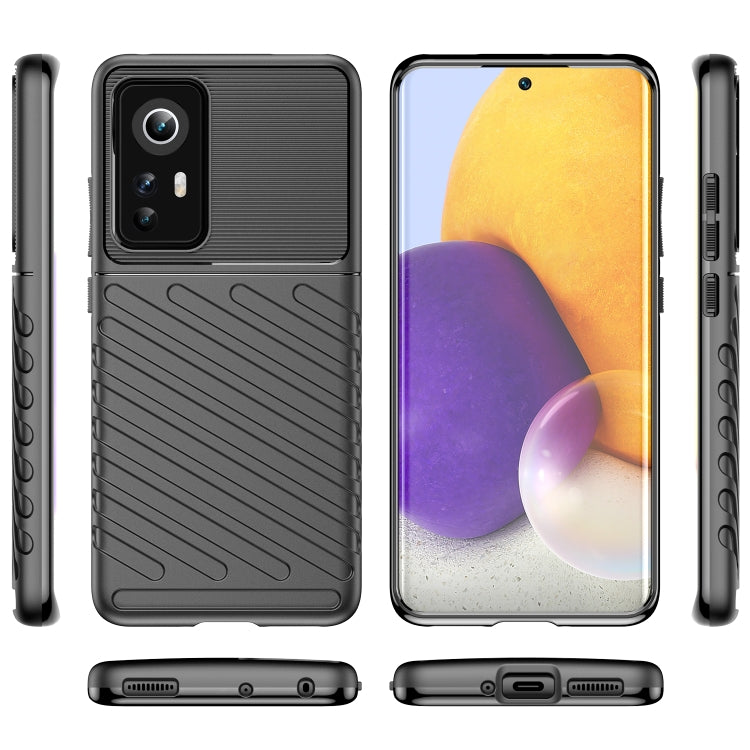Black shockproof TPU phone case with textured back and side button cutouts.