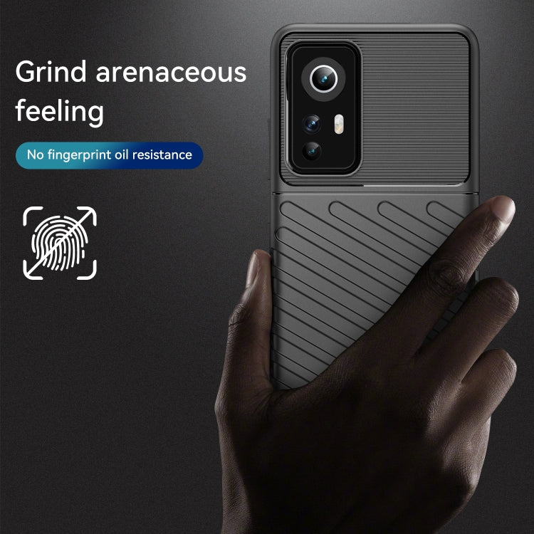 Black textured shockproof TPU phone case with raised camera and fingerprint-resistant finish.