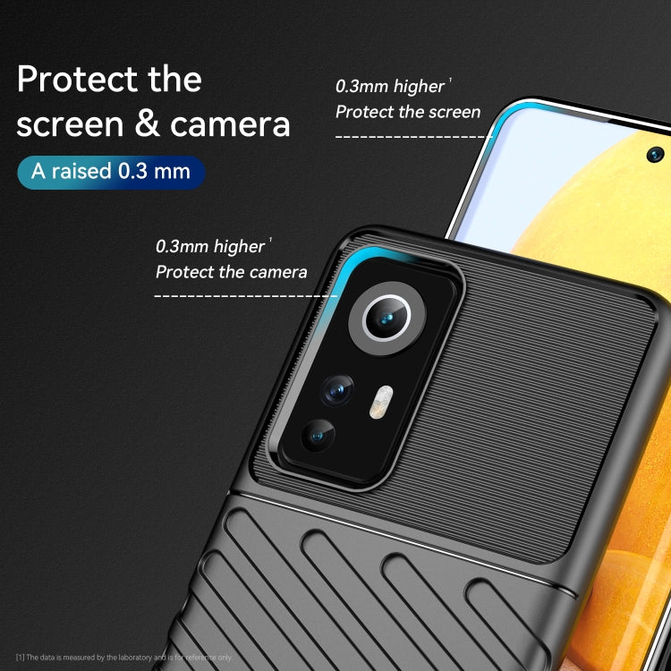 Black shockproof TPU phone case with raised edges for screen and camera protection.