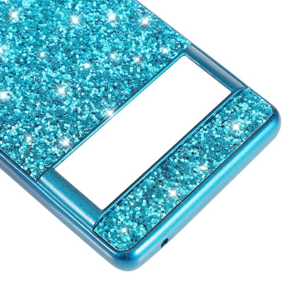 Blue glitter TPU phone case close-up with camera window and glossy bumper edges.