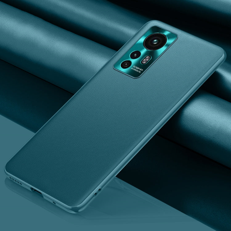 Teal leather phone case with camera cutout and raised edges for grip protection