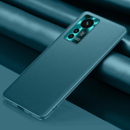 Teal leather phone case with camera cutout and raised edges for grip protection
