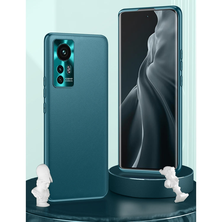 Teal leather phone case with camera cutout, shown with a matching phone front view