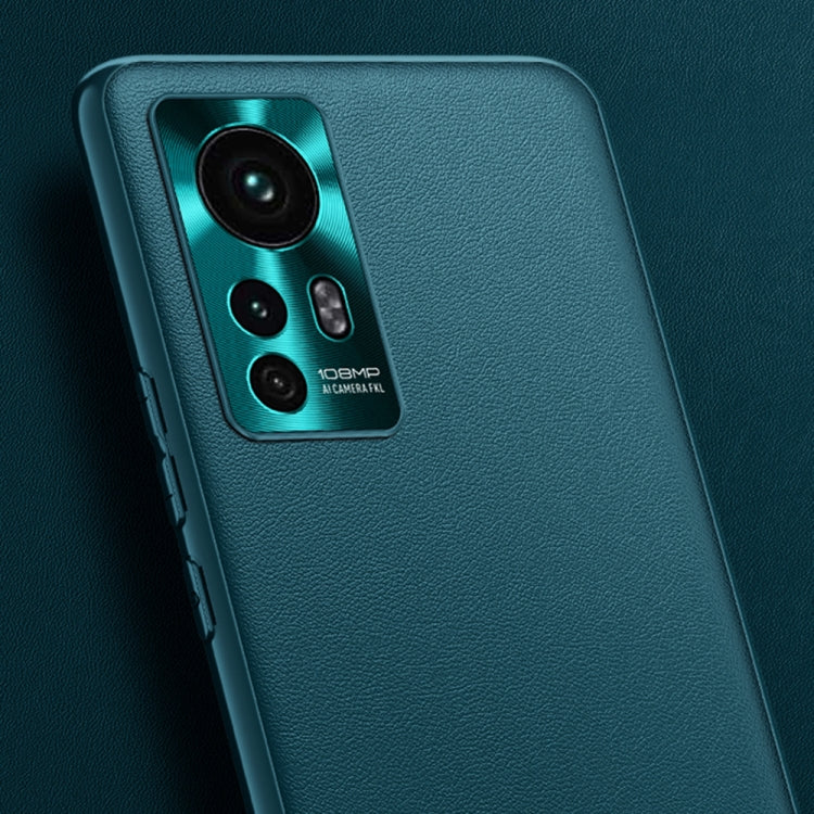 Teal leather phone case close-up with camera openings and textured surface