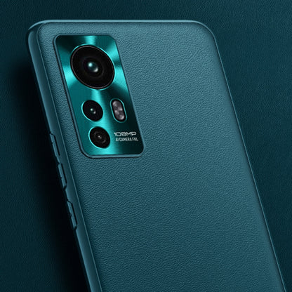 Teal leather phone case close-up with camera openings and textured surface