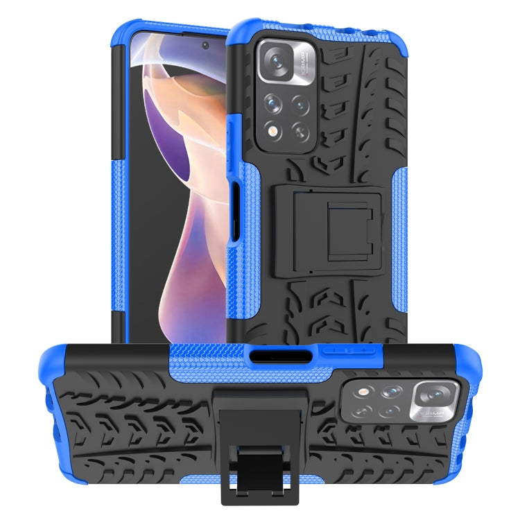 Blue and black tire-texture TPU/PC phone case with built-in holder stand.