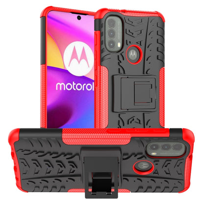 Red and black tire-texture TPU/PC phone case with holder for Motorola phone.