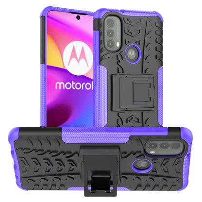 Purple and black tire-texture TPU/PC phone case with holder for Motorola phone.
