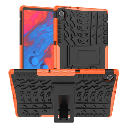 Orange and dark tablet case with textured TPU shell, built-in stand, and camera cutout