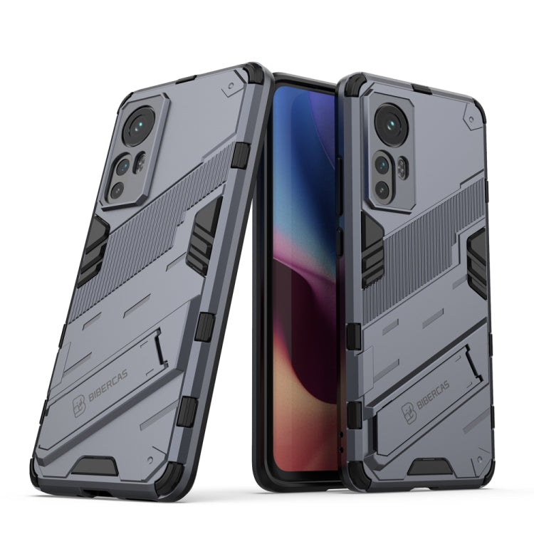Punk armor phone case with TPU shockproof design, gray and black with rugged grip panels.