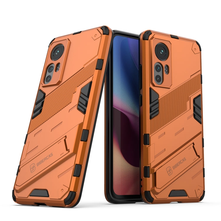 Punk armor phone case with TPU shockproof design, orange and black with dual-layer look.