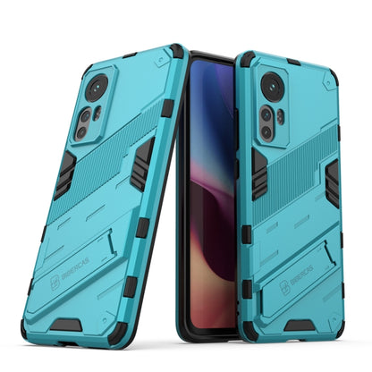 Rugged shockproof phone case with teal armor pattern and camera cutouts