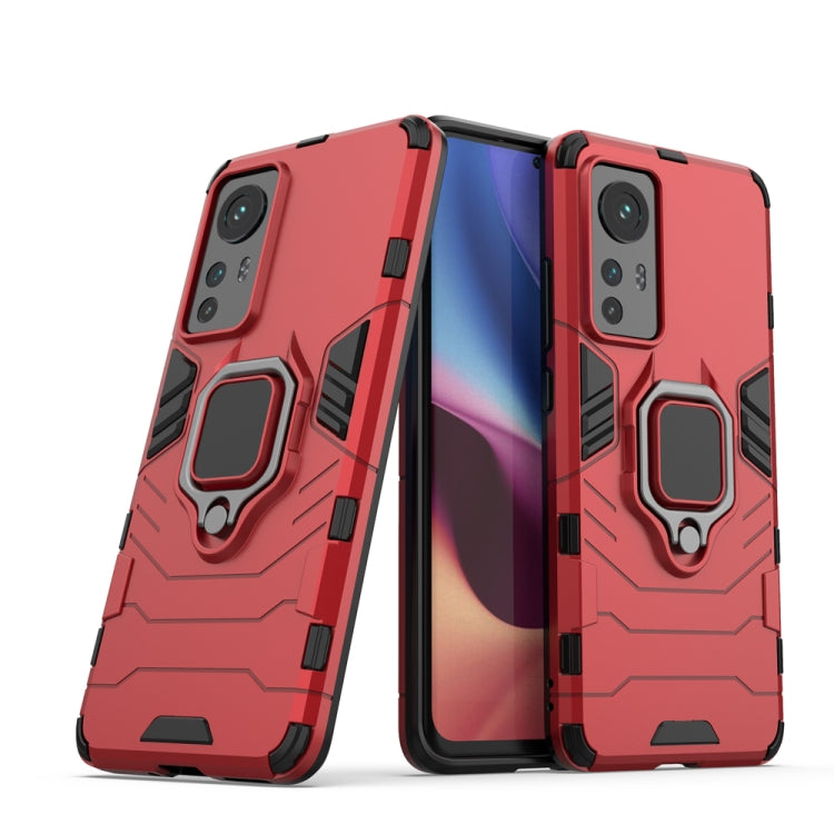 Red shockproof phone case with magnetic ring holder and protective raised back frame