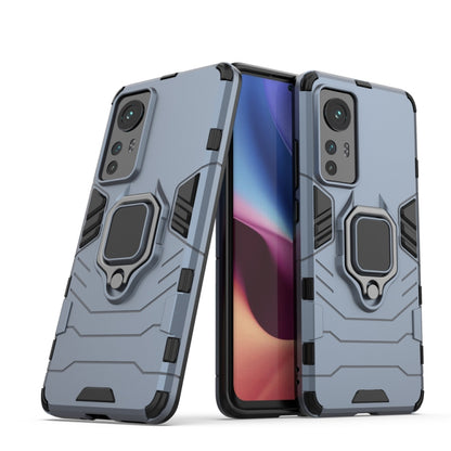 Light blue shockproof phone case with magnetic ring holder and camera cutouts