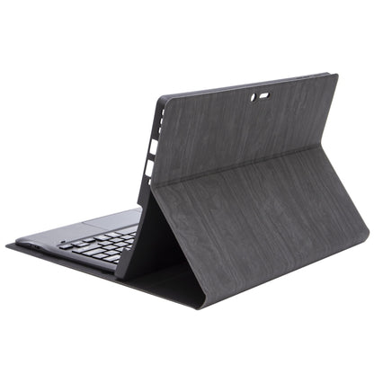 Folding tablet case with dark textured exterior and keyboard deck partially open