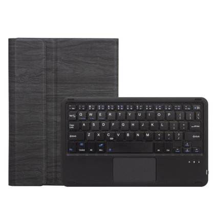 Black keyboard with trackpad inside dark gray leather case, front view