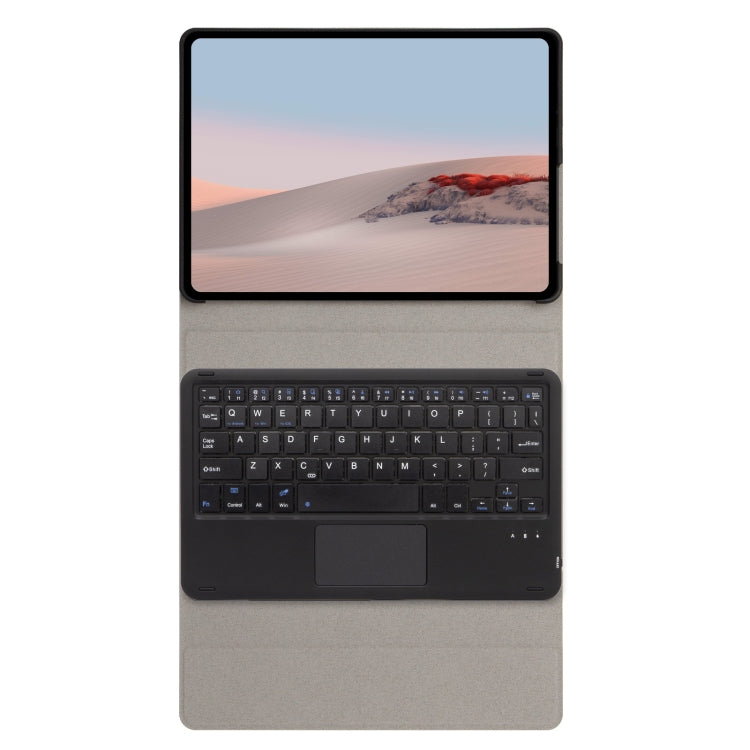 Tablet on dark gray leather keyboard case with built-in keyboard and touchpad