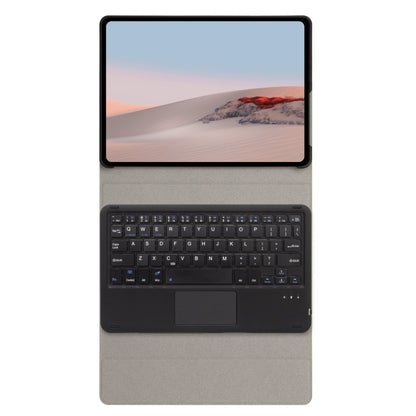 Tablet on dark gray leather keyboard case with built-in keyboard and touchpad