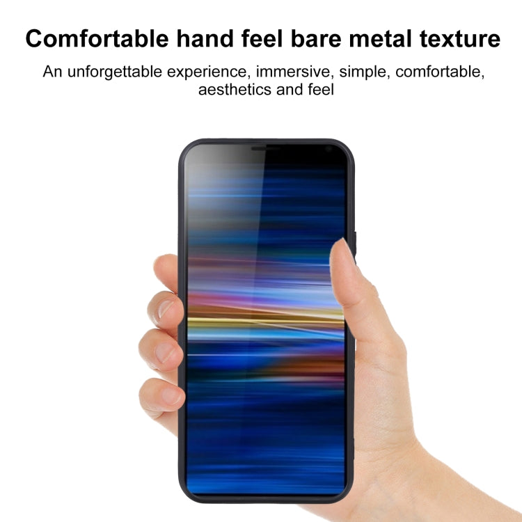 Dark TPU phone case held in hand over a phone screen
