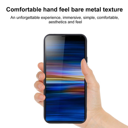 Dark TPU phone case held in hand over a phone screen